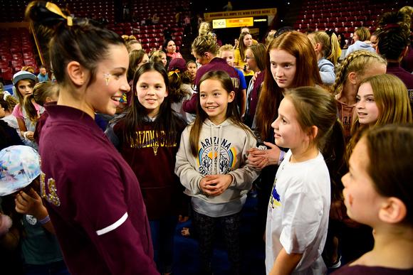 Sun Devil gymnast interacting with excited young girls